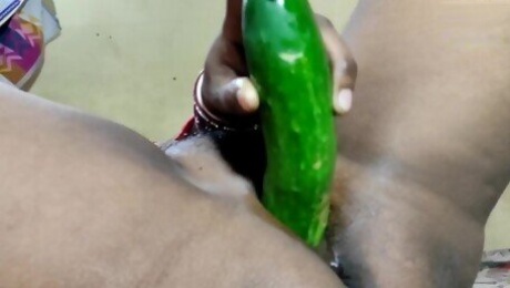 Desi indian teen girl using cocumber on camera